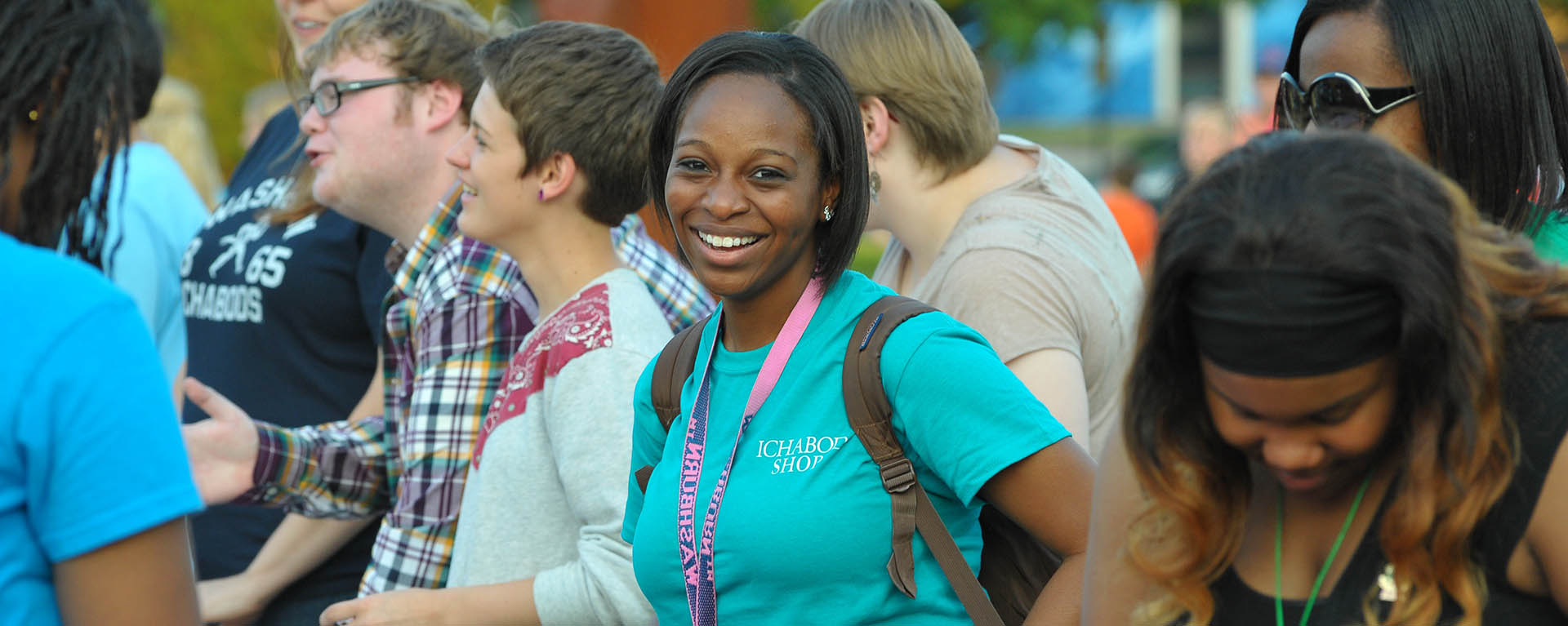 smiling female student in a crowd